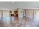 Bright, open-concept living space featuring wood-look floors and seamlessly connecting to the kitchen at 1326 Stephens Dr, Roxboro, NC 27573