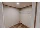 Walk-in closet with wire shelving and wood-look flooring, ready for organization at 1326 Stephens Dr, Roxboro, NC 27573