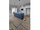 Kitchen featuring white cabinets, an island with a blue countertop, and pendant lighting at 1344 Bessie Ct, Wake Forest, NC 27587