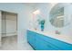 Elegant bathroom featuring a double vanity, dual mirrors and sinks, and access to a closet at 135 Brocks Trce, Burlington, NC 27215
