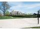 Sand volleyball court offers outdoor recreation with clubhouse in background at 135 Brocks Trce, Burlington, NC 27215
