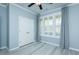 Cozy bedroom featuring window with plantation shutters, and a double door closet at 135 Brocks Trce, Burlington, NC 27215