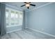 Inviting bedroom with plantation shutters, neutral walls, and a ceiling fan for added comfort at 135 Brocks Trce, Burlington, NC 27215