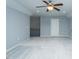 Bonus room with light gray walls, light carpet, ceiling fan, and lots of natural light at 135 Brocks Trce, Burlington, NC 27215