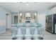 Modern kitchen with granite countertops, stainless steel appliances, and a breakfast bar with seating at 135 Brocks Trce, Burlington, NC 27215