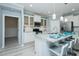 Modern kitchen with stainless appliances, granite counters, a breakfast bar and white cabinetry at 135 Brocks Trce, Burlington, NC 27215