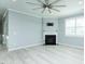 Inviting living room features light gray floors, a fireplace, and ample lighting at 135 Brocks Trce, Burlington, NC 27215