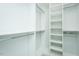 Spacious walk-in closet featuring custom shelving and ample storage space with chrome bars at 135 Brocks Trce, Burlington, NC 27215