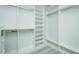 Spacious walk-in closet featuring custom shelving and ample storage space with chrome bars at 135 Brocks Trce, Burlington, NC 27215