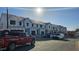 An image of townhomes under construction showing the framing stage and exterior materials being installed with a clear blue sky at 1367 Bessie Ct, Wake Forest, NC 27587