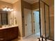 Bathroom with tile flooring, vanity, lighting, and glass shower at 1404 Rhea Dr, Garner, NC 27529