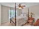 Bedroom showcases a four poster bed with a window providing ample natural light at 1404 Rhea Dr, Garner, NC 27529