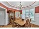 Formal dining room with hardwood floors, a hutch, a table with seating for six, and white trim at 1404 Rhea Dr, Garner, NC 27529