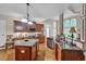Spacious kitchen with stainless steel appliances, wood cabinets, granite countertops, and an island at 1404 Rhea Dr, Garner, NC 27529
