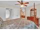 Spacious main bedroom showcasing a four-poster bed, ensuite bathroom and hardwood dresser at 1404 Rhea Dr, Garner, NC 27529
