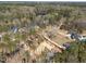 Aerial view of properties nestled in a neighborhood surrounded by trees at 1425 Lake Adventure Ct, Raleigh, NC 27613