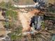Aerial view of property showcasing the layout, surrounding trees, and driveway at 1425 Lake Adventure Ct, Raleigh, NC 27613