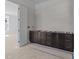 Unfinished bathroom with dark wood cabinets awaiting countertops and fixtures at 1425 Lake Adventure Ct, Raleigh, NC 27613