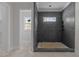 Modern bathroom features a dark-tiled shower with sleek fixtures and a built-in niche at 1425 Lake Adventure Ct, Raleigh, NC 27613