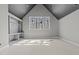 Bright room featuring a vaulted ceiling and an elegant built-in shelving unit at 1425 Lake Adventure Ct, Raleigh, NC 27613