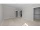 Large bedroom with multiple doors to other rooms, including closet with shelving at 1425 Lake Adventure Ct, Raleigh, NC 27613