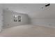 Upstairs bedroom features a large window with natural light and high ceiling at 1425 Lake Adventure Ct, Raleigh, NC 27613
