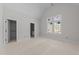 Unfinished bedroom with natural light streaming through two windows and neutral walls at 1425 Lake Adventure Ct, Raleigh, NC 27613
