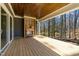 Outdoor deck featuring a fireplace and a wooded view at 1425 Lake Adventure Ct, Raleigh, NC 27613
