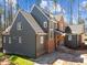 New construction home featuring gray siding, brick accents, and a stylish architectural design at 1425 Lake Adventure Ct, Raleigh, NC 27613
