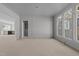 Open living area with decorative trim and large windows that offer ample natural light at 1425 Lake Adventure Ct, Raleigh, NC 27613