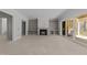 Spacious living room with built-in bookshelves, fireplace, and sliding glass doors to deck at 1425 Lake Adventure Ct, Raleigh, NC 27613