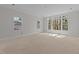 Bright living room with large windows at 1425 Lake Adventure Ct, Raleigh, NC 27613