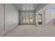 Large living room with natural light and decorative trim, awaiting finishing touches at 1425 Lake Adventure Ct, Raleigh, NC 27613