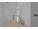 Bright staircase with multiple windows providing ample light from the second story landing at 1425 Lake Adventure Ct, Raleigh, NC 27613