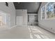 Upstairs room with a dark ceiling, a wall of built-in shelving, and a large window at 1425 Lake Adventure Ct, Raleigh, NC 27613