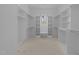 Spacious walk-in closet with built-in shelves and rods for optimal organization and natural light at 1425 Lake Adventure Ct, Raleigh, NC 27613