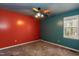 Bedroom features carpet flooring, a ceiling fan and light-colored walls with window at 1508 Middle Ridge Dr, Willow Springs, NC 27592