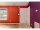 The entryway features a vibrant accent wall and convenient coat closet at 1508 Middle Ridge Dr, Willow Springs, NC 27592