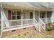 Inviting front porch with a cozy swing and charming curb appeal at 1508 Middle Ridge Dr, Willow Springs, NC 27592