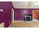 Living room featuring purple accent wall and fireplace at 1508 Middle Ridge Dr, Willow Springs, NC 27592