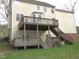 Backyard view of a two story deck and stairs at 1623 Rogers Pointe Ln, Creedmoor, NC 27522