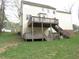 Backyard view of a two story deck and stairs at 1623 Rogers Pointe Ln, Creedmoor, NC 27522