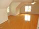 Spacious bedroom boasts hardwood floors and a ceiling fan, offering comfort and style at 1623 Rogers Pointe Ln, Creedmoor, NC 27522