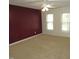 Expansive bedroom space featuring two bright windows and a ceiling fan at 1623 Rogers Pointe Ln, Creedmoor, NC 27522