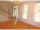 Bright entryway featuring hardwood floors, elegant chandelier, and a staircase leading to the upper level at 1623 Rogers Pointe Ln, Creedmoor, NC 27522