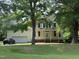 Inviting two-story home features an attached garage and covered porch entry at 1623 Rogers Pointe Ln, Creedmoor, NC 27522