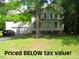 Traditional two-story home with a well-manicured lawn and attached two-car garage at 1623 Rogers Pointe Ln, Creedmoor, NC 27522