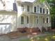 Lovely two-story home features a welcoming front porch with a brick foundation and vinyl siding at 1623 Rogers Pointe Ln, Creedmoor, NC 27522