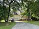 Lovely two-story home with mature trees, attached garage and inviting entryway at 1623 Rogers Pointe Ln, Creedmoor, NC 27522