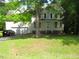 Charming front view of a two-story home featuring a two-car garage and well-manicured lawn at 1623 Rogers Pointe Ln, Creedmoor, NC 27522